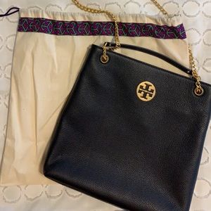 Tory Burch adjustable shoulder to crossbody purse. Magnetic closure. Used once